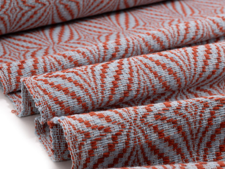 handwoven cotton fabric dyed with padauk bark in a flower pattern