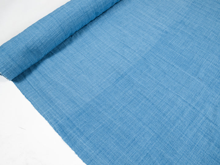 handwoven cotton fabric dyed with indigo in light blue color